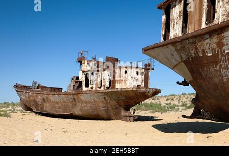 Boats in desert around Moynaq, Muynak or Moynoq - Aral sea or Aral lake - Uzbekistan - asia Stock Photo