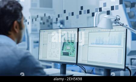 Electronics Design Factory Office: Team of Electrical Engineers Working on Computers, using CAD Software to Develop Microchips, Semiconductor Stock Photo