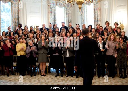 Teachers attending the Presidential Awards for Mathematics and Science applaud as President Barack Obama enters the State Dining Room of the White House, prior to the 'Educate to Innovate' event for excellence in Science, Technology, Engineering & Math (STEM),  Jan. 6, 2010. Stock Photo