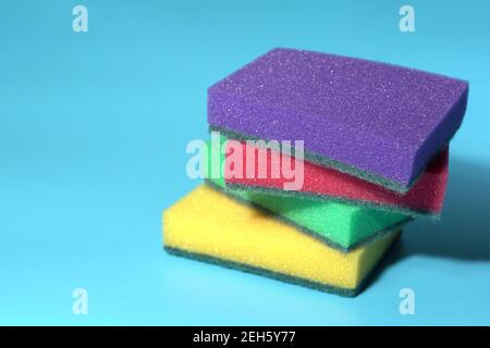 https://l450v.alamy.com/450v/2eh5y77/dishwashing-sponges-on-a-blue-background-2eh5y77.jpg