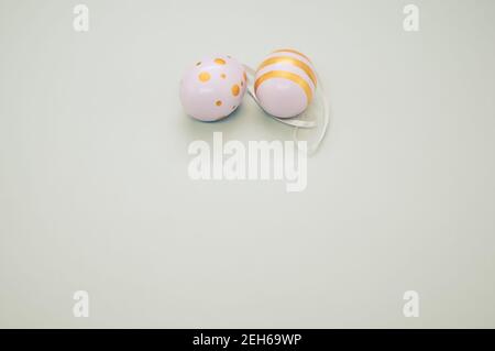 Easter eggs colored with golden paint in different patterns isolated on a white background Stock Photo