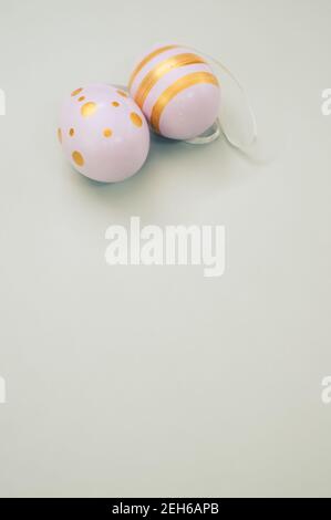 Easter eggs colored with golden paint in different patterns isolated on a white background Stock Photo