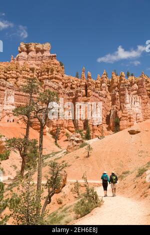 BRYCE CANYON, UT - May 26, 2012. Caucasian couple hiking on a trail through Bryce Canyon National Park, Utah, USA Stock Photo