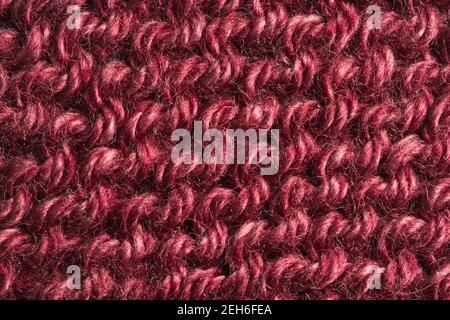 Closeup of red burgundy colored knitted yarn pattern Stock Photo