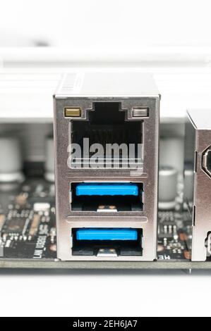 Usb 3.2 type-a and LAN ports on a computer motherboard on white background Stock Photo
