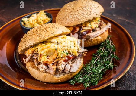 Pulled Pork meat Hamburger with coleslaw salad. Dark background. Top view Stock Photo