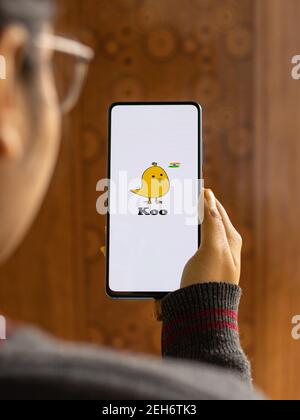 Assam, india - February 19, 2021 : Koo app logo on phone screen stock image. Stock Photo