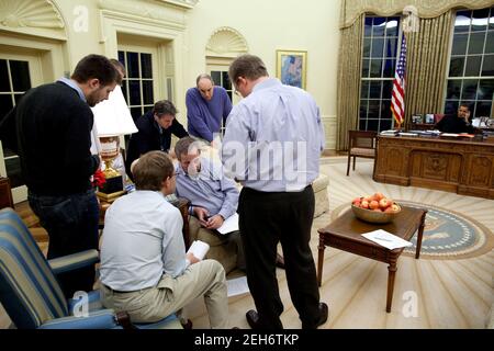President Barack Obama makes phone calls regarding the auto industry in the Oval Office, March 29, 2009. Stock Photo