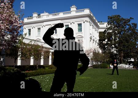 President Barack Obama practices his pitching with TK in the Rose Garden of the White House, March 31, 2010. Later that day, the President threw out the first pitch on opening day of the baseball season prior to the game between the Washington Nationals and the Philadelphia Phillies. Stock Photo