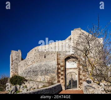 The small medieval village of Castel San Pietro Romano, Lazio, province of Rome, Palestrina. The ancient entrance to the castle with the bridge and ga Stock Photo