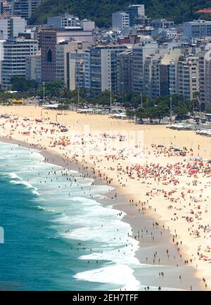 Copacabana beach in Rio de Janeiro, Brazil. Copacabana beach is the most famous beach of Rio de Janeiro, Brazil. Skyline of Rio de Janeiro Stock Photo