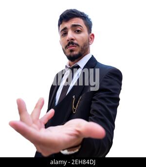 Glory and proud for man standing while holding his suit jacket on his shoulders and looking forward to the others from his pride to others Stock Photo