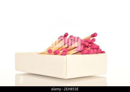 One paper box with wooden matches on a white background. Stock Photo