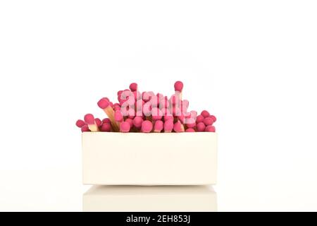 One paper box with wooden matches on a white background. Stock Photo