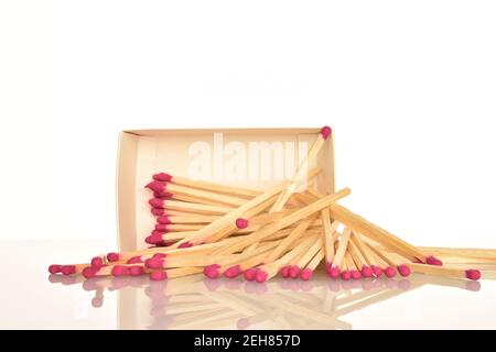 One paper box with wooden matches on a white background. Stock Photo