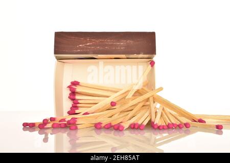One paper box with wooden matches on a white background. Stock Photo