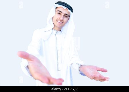 Arabic young man welcoming other people Stock Photo