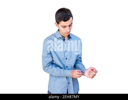 Young arabic guy doing his buttons Stock Photo
