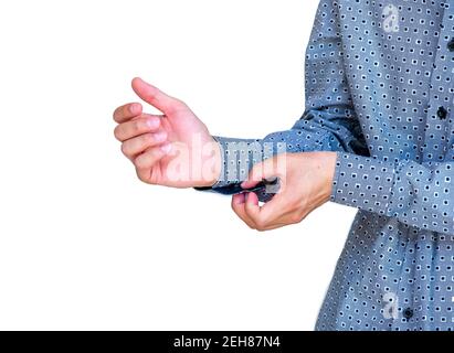Young arabic guy doing his buttons Stock Photo