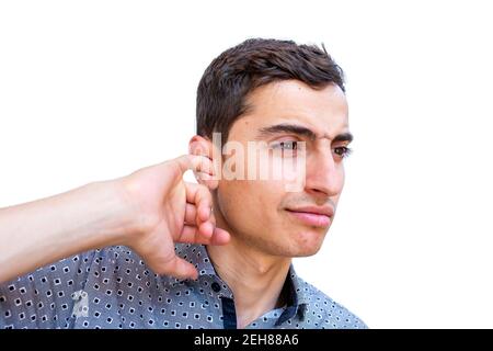 Young arabic guy cleaning his ear Stock Photo