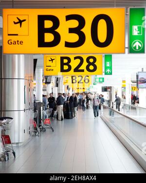 AMSTERDAM, HOLLAND- 10 APRIL 2014:Gate at Schiphol airport in Amsterdam. Stock Photo
