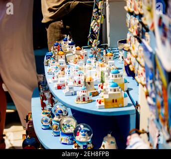 Santorini, Greece - September 11, 2017: Art shop display small architecture colorful building of santorini city for sale as souvenir Stock Photo