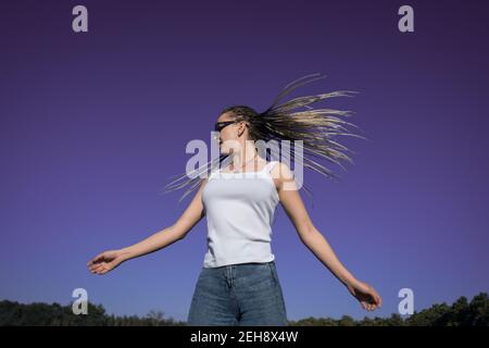 Beautiful woman waving hair with stylish afro braids Stock Photo