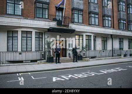 LONDON, UK 19 February 2021. Police officers  wearing protective facemask guard the front door of the King Edward VII hospital where  HRH Prince Philip, Duke of Edinburgh aged 99 years old  has been receiving medical treatment as a precautionary measure since  being admitted to hospital on 16th February after feeling unwell. Credit amer ghazzal/Alamy Live News Stock Photo