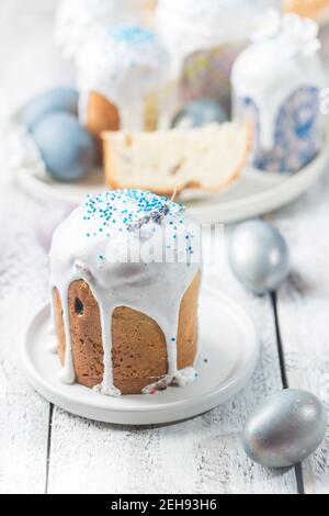 Easter table with Easter cakes and Easter eggs over white background Stock Photo