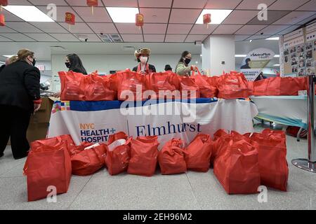 New York, USA. 19th Feb, 2021. Bags filled with groceries are prepared for distribution for Lunar New Year Celebration food distribution inside Elmhurst Hospital in the Queens borough of New York City, NY, February 19, 2021. As the impact of the COVID-19 pandemic continues to affect the economy, it is estimated that food insecurity in the United States has doubled, and tripled in households with children. (Photo by Anthony Behar/Sipa USA) Credit: Sipa USA/Alamy Live News Stock Photo