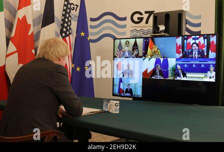 London, UK. 19th Feb 2021.  British Prime Minister Boris Johnson attends a virtual meeting of the leaders of the Group of Seven at Downing Street in London, Britain, on Feb. 19, 2021. The leaders of the Group of Seven (G7) on Friday pledged to cooperate with the Group of 20 (G20) and other international institutions on a range of global issues including fighting coronavirus pandemic, climate change and upholding the rules-based multilateral trading system, sending signals that the G7 will be committed to multilateral cooperation. Stock Photo