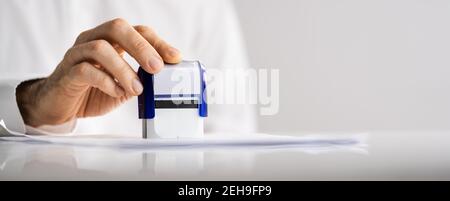 Approved Paper Document Stamp. Permit Rubber Stamper Stock Photo