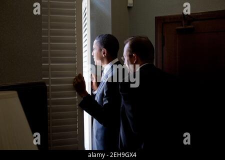 President Barack Obama waits with Press Secretary Robert Gibbs in the Doheny Memorial Library before a rally at the University of Southern California Alumni Park in Los Angeles, Calif., Oct. 22, 2010. Stock Photo