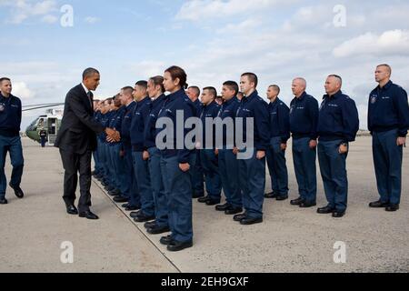 President Barack Obama greets personnel at Joint Base Andrews, Md., before boarding Air Force One, Oct. 25, 2010. Stock Photo