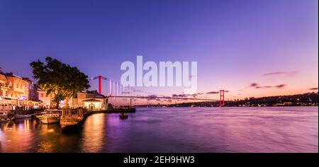 Istanbul Bosphorus Bridge sunset view. 15th July Martyrs Bridge (15 Temmuz Sehitler Koprusu). Colorful bosphorus landscape in Istanbul, Turkey. Stock Photo