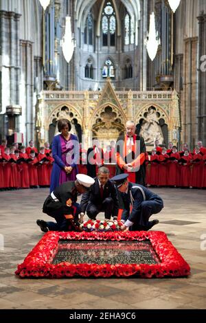 President Barack Obama, assisted by members of the U.S. military, lays a wreath at the Grave of the Unknown Warrior at Westminster Abbey in London, England, May 24, 2011. Stock Photo