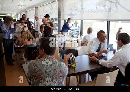 President Barack Obama talks with Puerto Rican Senator Alejandro Garcia Padilla during a lunch stop at Kasalta, a restaurant in the Ocean Park neighborhood of San Juan, Puerto Rico, June 14, 2011. Stock Photo