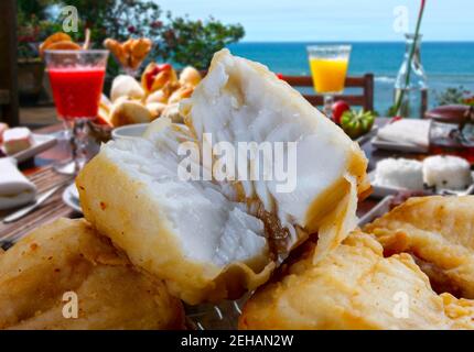 Fried sliced fish fillet at the beach restaurant Stock Photo