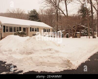 Clear roads after a large snowstorm in Northern New Jersey. Roads are clear and side streets show piled snow. Stock Photo