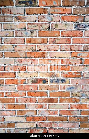 Background is brick wall. Wall is made of old burnt bricks Stock Photo