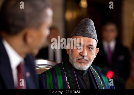 Afghan President Hamid Karzai listens as President Barack Obama delivers remarks during the strategic partnership agreement signing ceremony at the Presidential Palace in Kabul, Afghanistan, May 1, 2012. Stock Photo