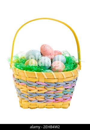 Easter eggs in a yellow wicker basket. Stock Photo