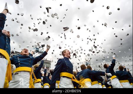 Newly commissioned second lieutenants throw their hats in the air during the commencement ceremony at the United States Air Force Academy in Colorado Springs, Colo., May 23, 2012. Stock Photo