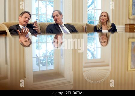 Treasury Secretary Timothy Geithner speaks during a meeting with President Barack Obama in the Oval Office, June 4, 2012. Mike Froman, Deputy National Security Advisor for International and Economic Affairs, and Lael Brainard, Under Secretary of the Treasury for International Affairs, are seated next to Secretary Geithner. Stock Photo