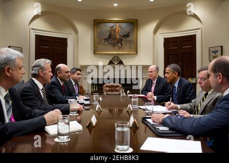 President Barack Obama drops by a meeting between National Security Advisor Tom Donilon and Deputy Prime Minister Shaul Mofaz of Israel, third from left, in the Roosevelt Room of the White House, June 21, 2012. Stock Photo