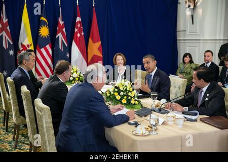 President Barack Obama attends the Trans-Pacific Partnership (TPP) meeting at the ASEAN Summit at Peace Palace in Phnom Penh, Cambodia, Nov. 20, 2012. Taking part in the meeting, clockwise from  the President, are; Sultan of Brunei Hassanal Bolkiah; Prime Minister Mohammed Najib Abdul Razak of Malaysia; Prime Minister John Key of New Zealand; Prime Minister Lee Hsien Loong of Singapore; Prime Minister Nguyen Tan Dung of Vietnam; and Prime Minister Julia Gillard of Australia. Stock Photo