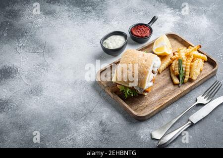 homemade baguette with crumbed fish set, on gray background , with copyspace and space for text Stock Photo