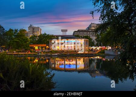 Evening sunset along the Spokane River in Riverfront Park, a public urban park with carousel and events in the city of Spokane, Washington, USA Stock Photo