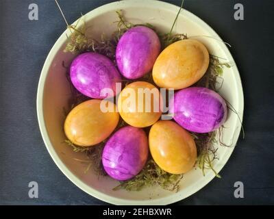 Easter decoration with colored eggs against a black background Stock Photo