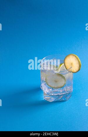 Ice cold drink with lime slices attached Stock Photo